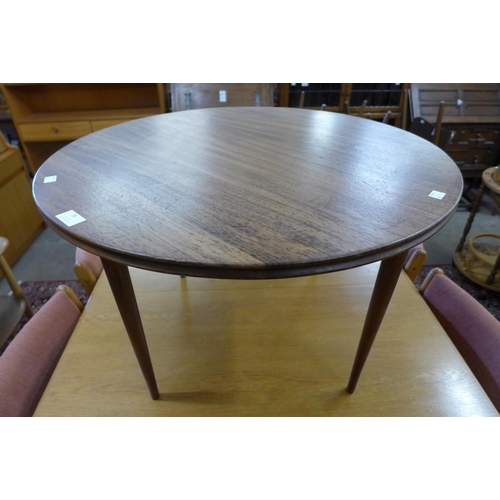 78 - A teak circular coffee table