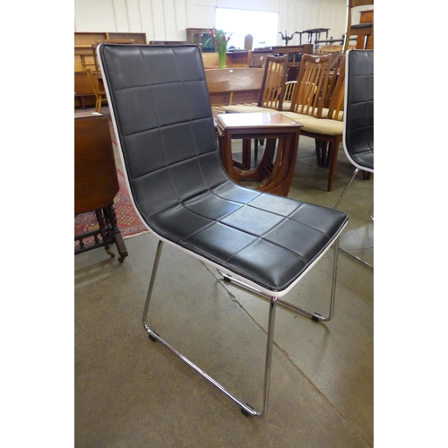 83 - A chrome and white laminate circular table, four chairs and a trolley