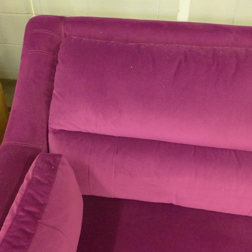 1469 - A Fuchsia velvet high back four seater sofa