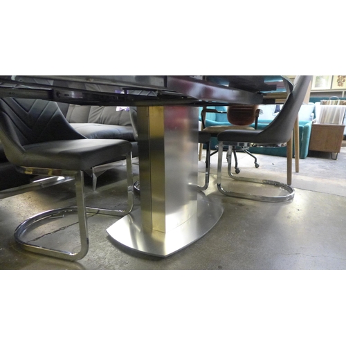 1493 - A Furniture Village Flow glass swivel top dining table with a set of four grey leather effect dining... 