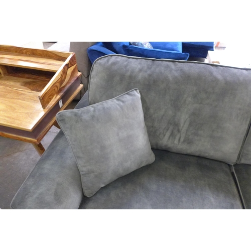 1523 - A crocodile green velvet four seater sofa