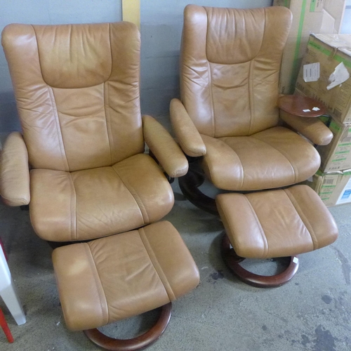 1685 - A pair of tan leather Stressless armchairs and footstools