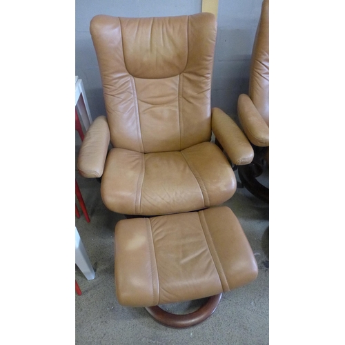 1685 - A pair of tan leather Stressless armchairs and footstools