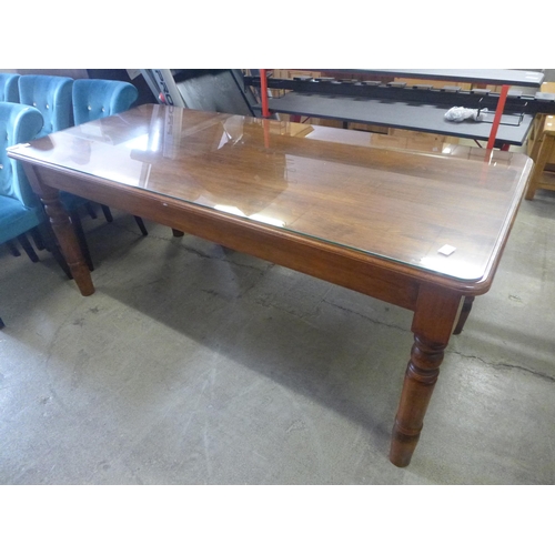 1687 - A pine dining table with glass top