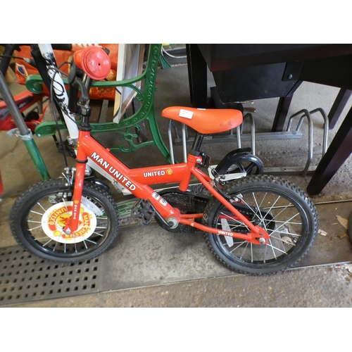 2120 - A Manchester United children' BMX bike plus two push scooters