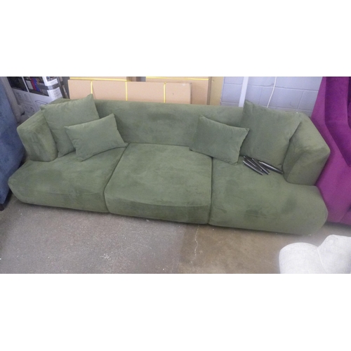 1476 - A moss green velvet three seater sofa