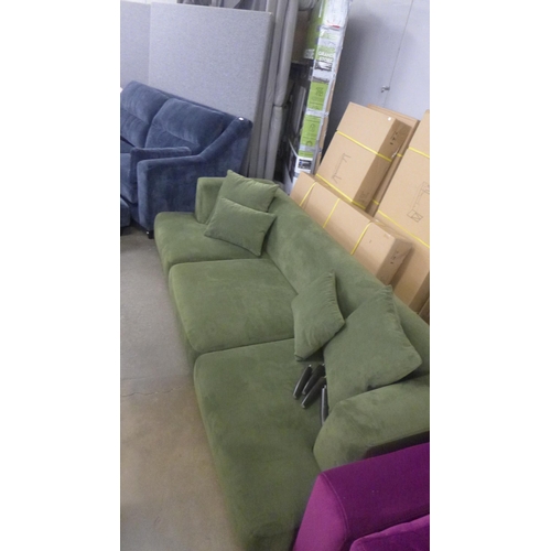 1476 - A moss green velvet three seater sofa