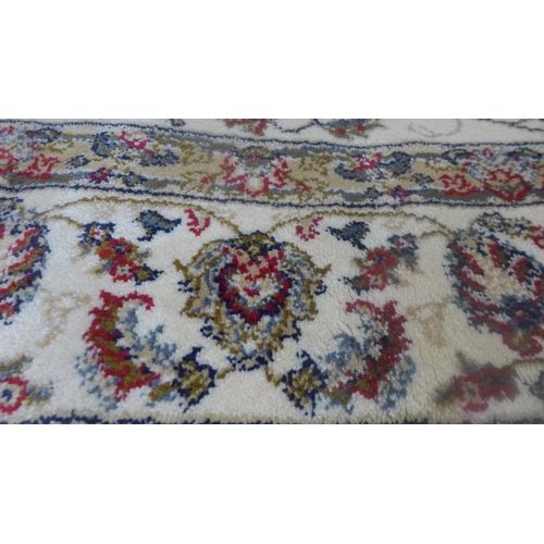 1486 - An Ivory ground cashmere rug, full pile with all over floral design 170 x 120cm