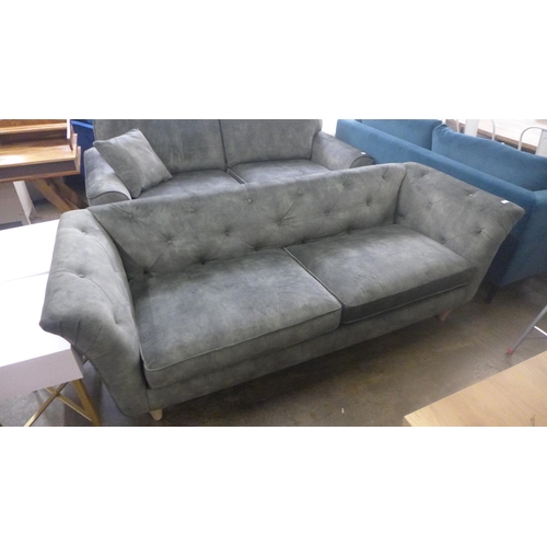 1522 - A crocodile green button back four seater sofa