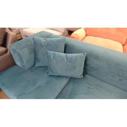 1350 - A Turquoise velvet three seater sofa