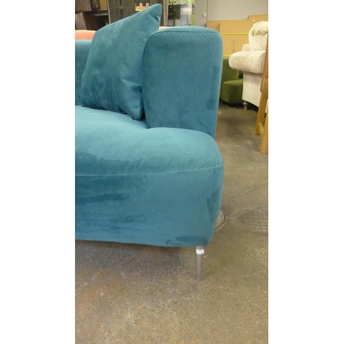 1350 - A Turquoise velvet three seater sofa