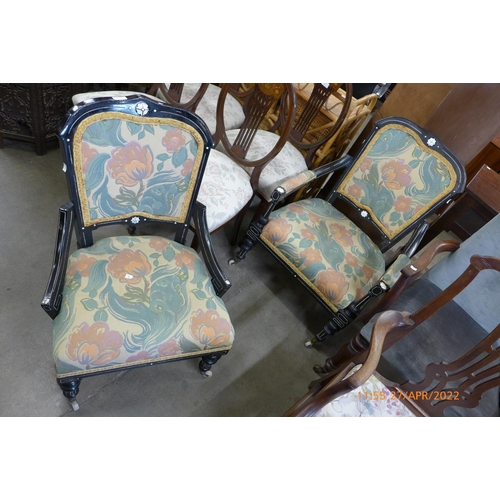 171 - A pair of Victorian Aesthetic Movement ebonised and fabric upholstered chairs