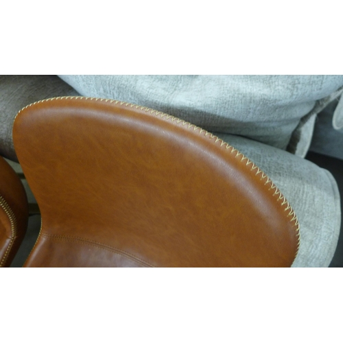 1465 - A pair of leather effect stitched side chairs