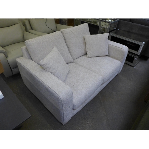 1519 - An oatmeal upholstered two seater sofa