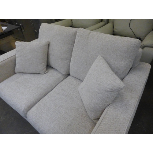 1519 - An oatmeal upholstered two seater sofa