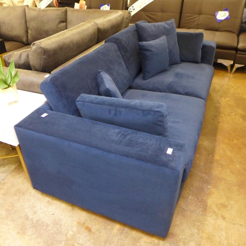 1521 - A blue velvet three seater sofa