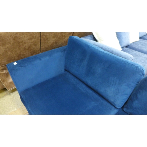 1523 - A blue velvet three seater sofa