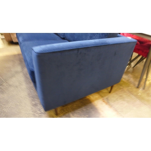 1523 - A blue velvet three seater sofa