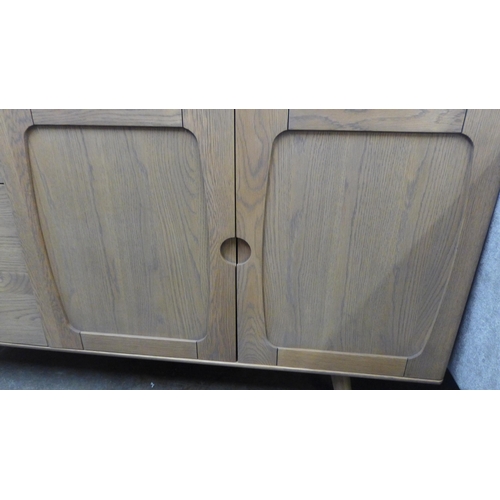 1534A - A mid century style oak large sideboard