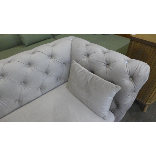 1535 - A light stone velvet Chesterfield three seater sofa