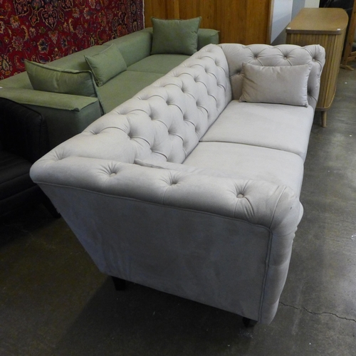 1535 - A light stone velvet Chesterfield three seater sofa