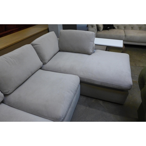 1544 - A light stone RHF corner sofa