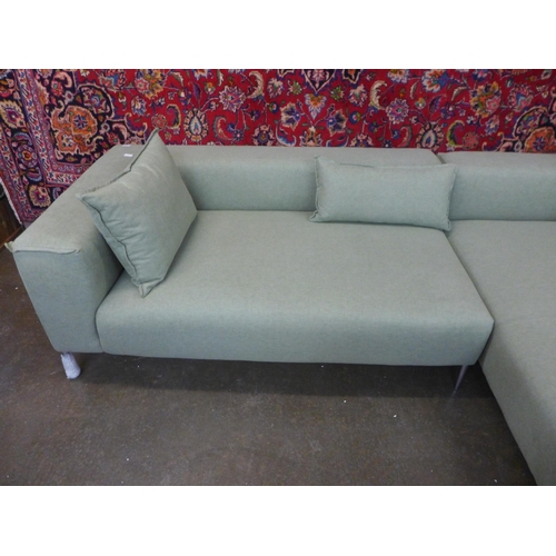 1557 - A pistachio upholstered RHF corner sofa