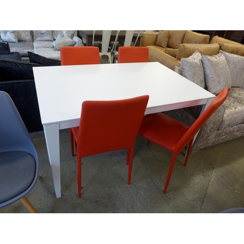 1617 - A Ingenia white extending dining table and a set of four red leather effect dining chairs