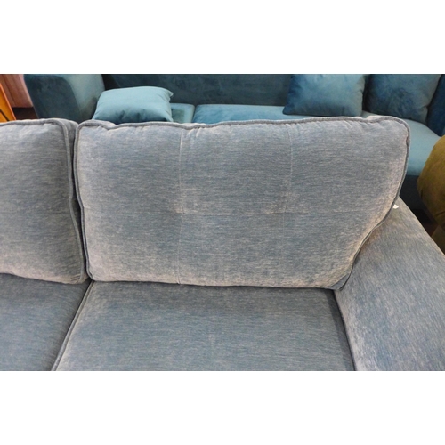 1354 - A teal velvet three seater sofa