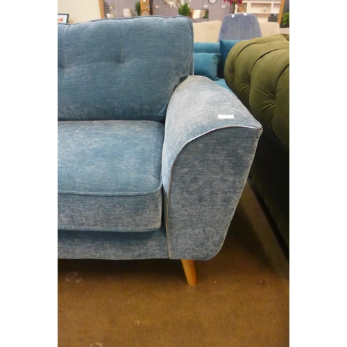 1354 - A teal velvet three seater sofa