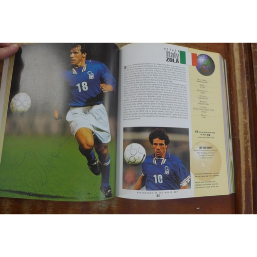 655 - A 1998 Superstars of The World Cup book containing autographs from former players including Zola, So... 