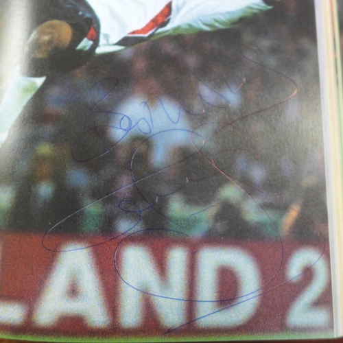 655 - A 1998 Superstars of The World Cup book containing autographs from former players including Zola, So... 