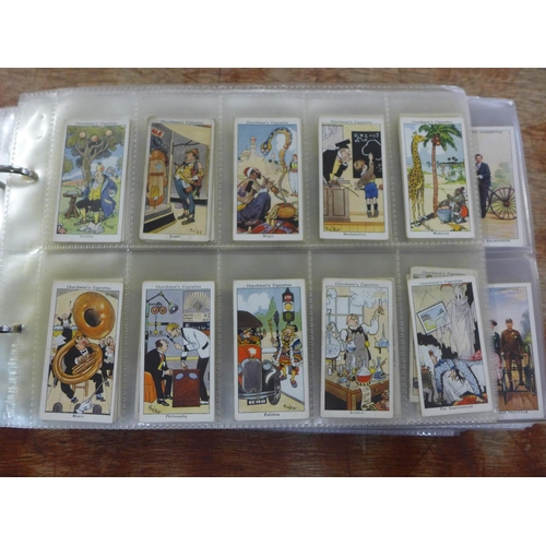 667 - Cigarette cards; an album of cigarette and trade cards containing thirteen complete sets