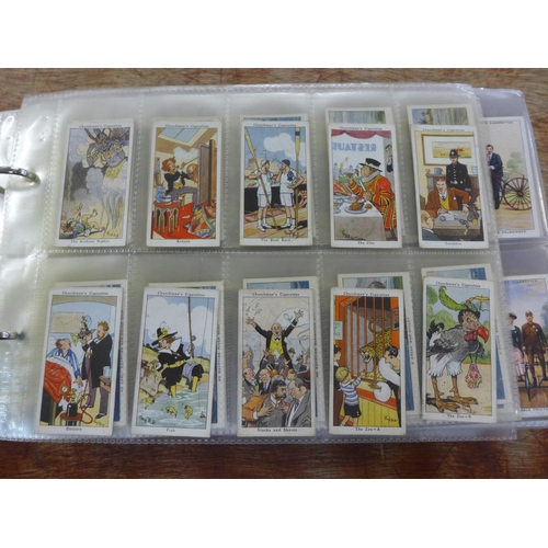 667 - Cigarette cards; an album of cigarette and trade cards containing thirteen complete sets