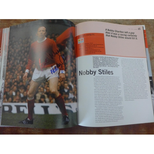 669 - A Manchester United player roster book containing 96 signatures of former players and managers inclu... 