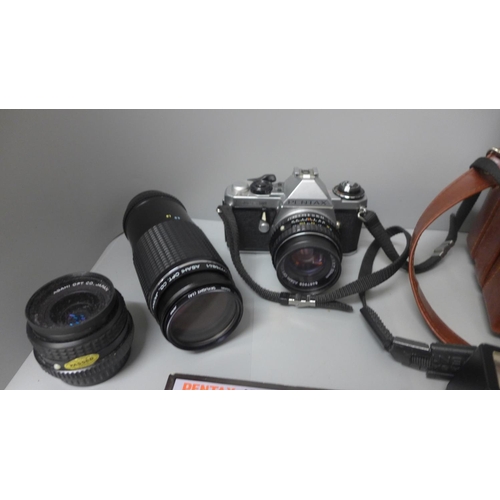 677 - A Pentax ME Super camera with 1:17 50mm lens, 1:2.8 28mm lens and 1:4.5 80mm-200mm lens, flash instr... 