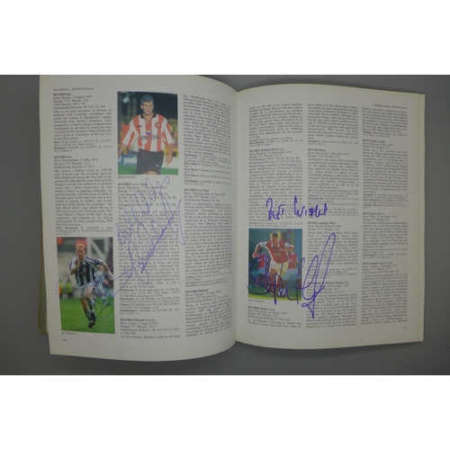 687 - A 1999-2000 PFA Footballers Factfile containing approximately 145 signatures including Duncan Fergus... 