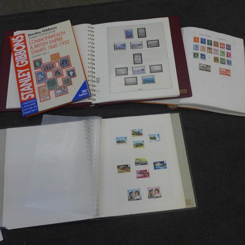 721 - Stamps; a box of stamp albums and catalogue