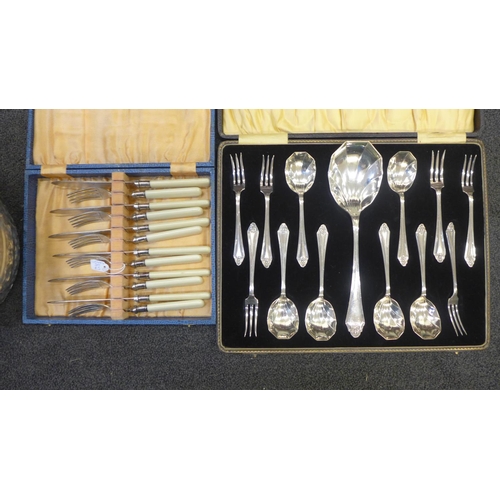 729 - Stainless steel and silver plated cutlery including a plated fruit set, cased