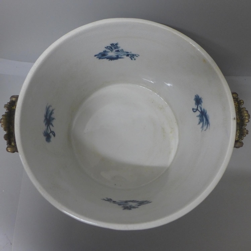 800 - An oriental blue and white two handled brass feet planter