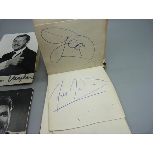 830 - An autograph book with celebrity signatures including Cliff Richard x2, Norman Vaughan, The Fourmost... 