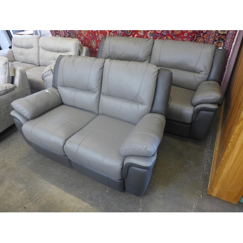 1568 - A Pluto leather three seater and two seater power reclining sofas