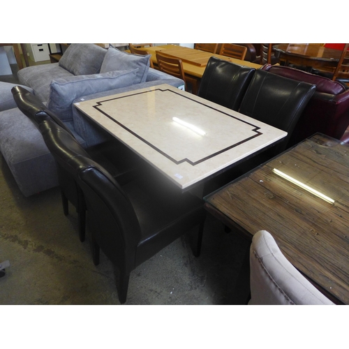 1575 - A cream and mocha marble effect dining table with a set of four brown leather dining chairs