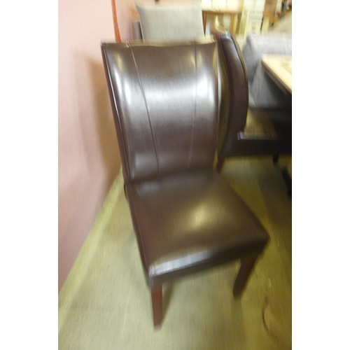 1575 - A cream and mocha marble effect dining table with a set of four brown leather dining chairs