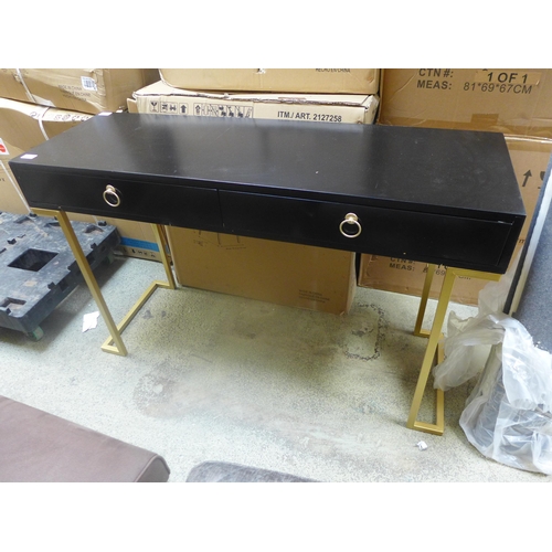 1589 - A black two drawer console table with gold legs - damaged corner