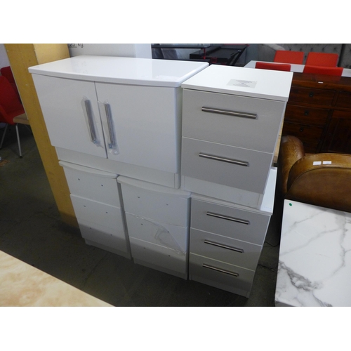 1600 - A small ivory two door cabinet and two pairs of bedside chests