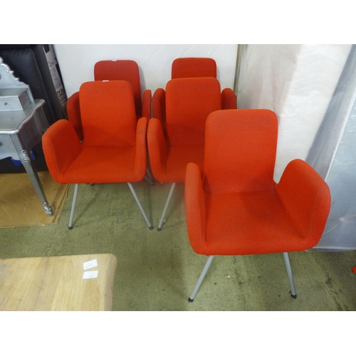 1602 - A set of five red upholstered chairs