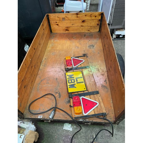 2451 - Approx. 6ft x 4ft trailer with board & electrics, drop back in varnished wood plus spare wheel