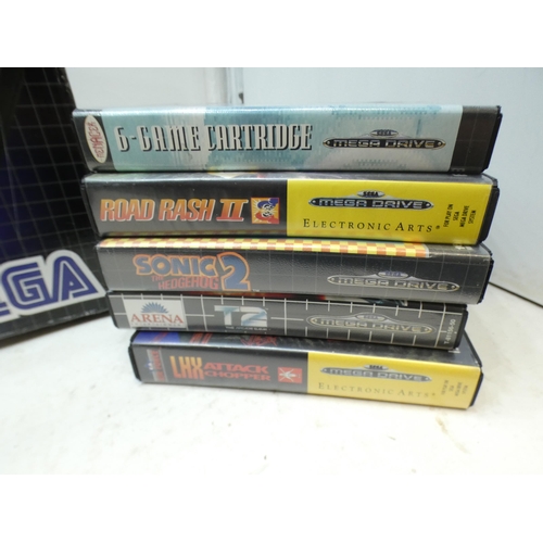 2205 - Sega Megadrive 16 bit gaming console in original box - W with 12 games & 2 controllers