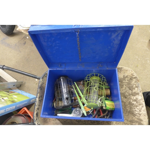 2436 - Metal wheelbarrow and a tin of garden accessories and hand tools